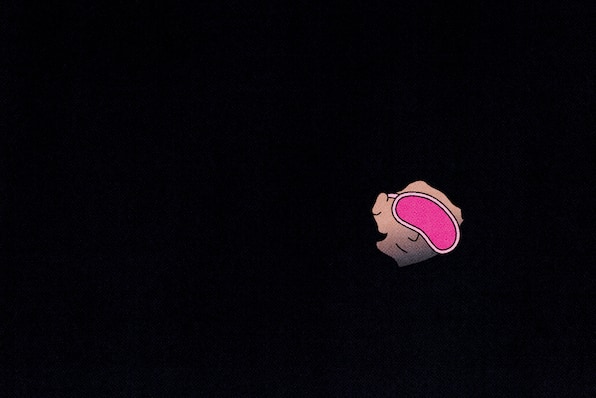 An illustration of a person wearing a pink sleeping mask, covered in darkness with just their face showing. 